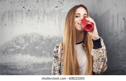 Pretty Young Woman Drinking A Coke