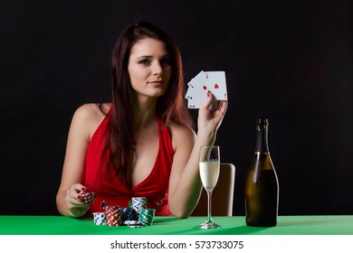 Pretty Young Woman Gambling On Green Table