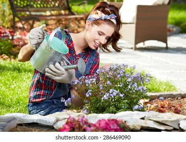 Pretty Young Woman In Garden