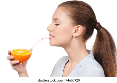 Pretty young woman with half orange isolated on the white background