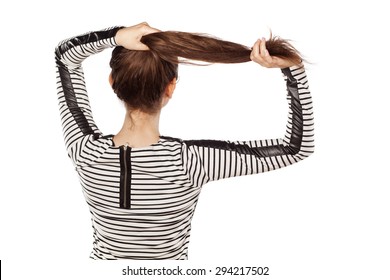 pretty young woman holding her hair with her hands