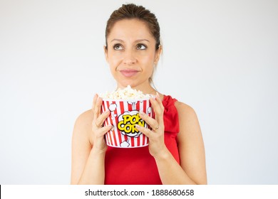 pretty young woman holding a pop corn bowl over white background