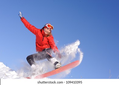 Pretty Young Woman On Snowboard