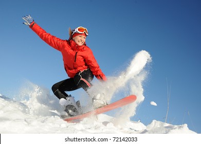 Pretty Young Woman On Snowboard