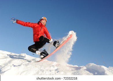 Pretty Young Woman On Snowboard