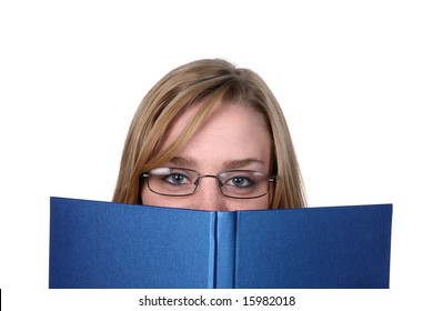 Pretty Young Woman Peeking Over Top Of Blue Book