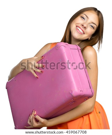 Pretty young woman with pink suitcase