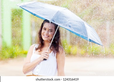 Pretty Young Woman In The Rain With Umbrella