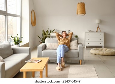 Pretty young woman relaxing at home - Powered by Shutterstock