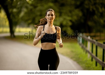 Similar – Fit healthy athletic woman jogging on a river bank