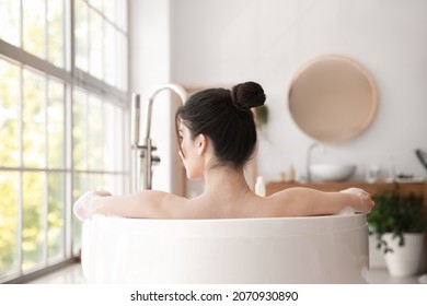 Pretty Young Woman Taking Bath At Home