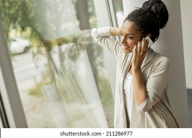 Pretty young woman talking on the phone
