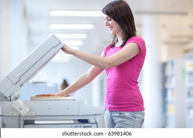 Pretty Young Woman Using A Copy Machine (shallow DOF; Color Toned Image)