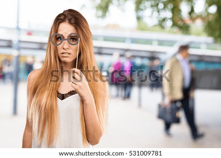 pretty young woman using party glasses