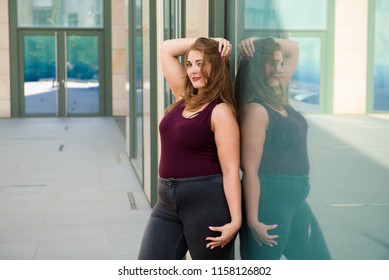 Pretty Young Woman Walking On The City Street. Casual Fashion, Plus Size Model. Xxl Women On Nature.