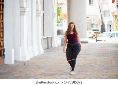 Pretty Young Woman Walking On The City Street. Casual Fashion, Plus Size Model. Xxl Women On Nature.