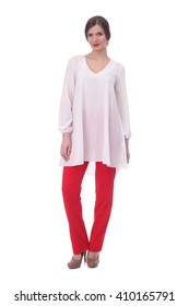 Pretty Young Woman Wearing White Tunic And Red Pants