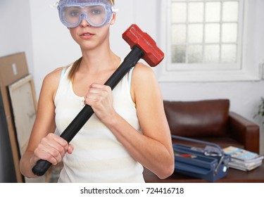  Pretty Young Working Woman With A Sledgehammer