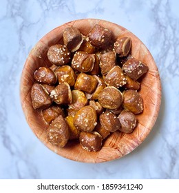 Pretzel Bites In Wooden Bowl On White Granite Countertop