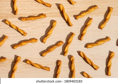 A Pretzel Pattern On A Wood Table.