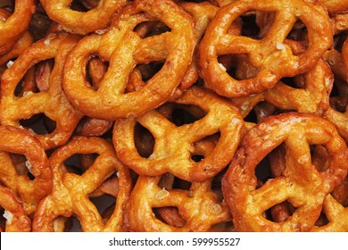 Pretzel Shaped Bread Sticks Cracker Texture Pattern. Salted Pretzels. Mini Pretzel Snack Texture.