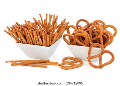 Pretzel Snacks In Porcelain Bowls Over White Background.