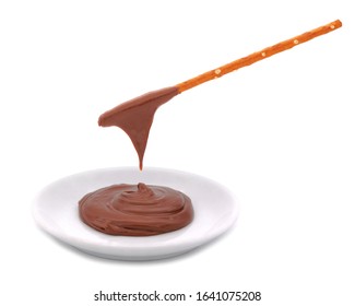 Pretzel Sticks Dipped In Bowl Of Chocolate Cream Isolated On White Background