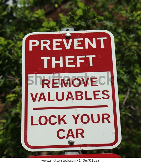 PREVENT THEFT SIGN\
LOCK YOUR\
CAR