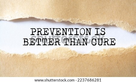 Prevention is Better than Cure word written under torn paper.