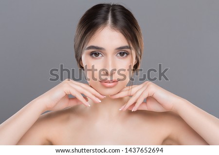 Prevention of double chin. Young beautiful woman with perfect skin massaging her face