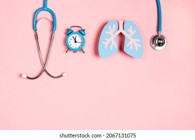 Prevention of pulmonary disease. Lung symbol, stethoscope and alarm clock on a pink background. Healthcare and medicine concept.  - Shutterstock ID 2067131075