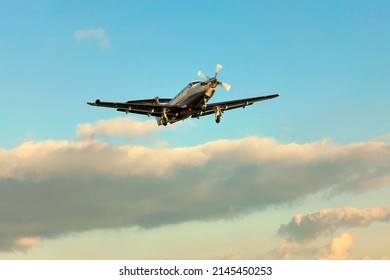 PRIBRAM AIRPORT, CZ - 25 NOV 2010:  Single turboprop PILATUS PC-12 NG flying, on background blue sky and clouds.