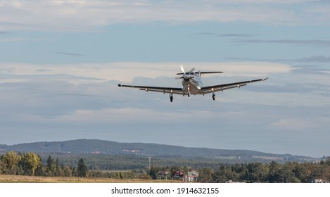 PRIBRAM, CZECH REPUBLIC - 1 October 2019. The Pilatus PC-12 NG single turboprop aircraft flies in the blue sky. The plane leaves from a small airport.