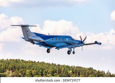PRIBRAM, CZECH REPUBLIC - 12 August 2020. Pilatus PC-12 NGX, Single-engine turboprop blue airplane. The plane take off from a small airport.
