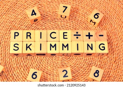 PRICE SKIMMING Word Text From Wooden Cube Block Letters. Price Skimming Is A Price Setting Strategy That A Firm Can Employ When Launching A Product Or Service For The First Time.