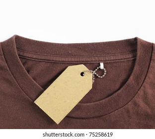 Price Tag Hang Over Brown Tshirt. Isolated Over White Background