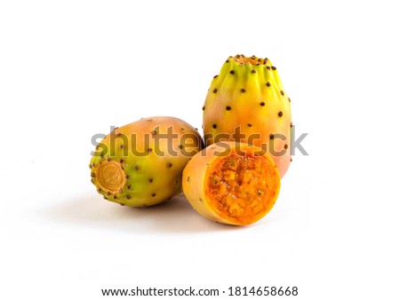 Prickly pears, healthy nopal cactus fruit, isolated on white background. One piece is cut in half, showing juicy inside. 