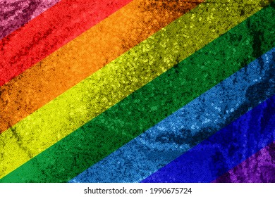 Pride Flag Colors Background. Metal Glitter Cloth Wallpaper. Gay Pride Flag Metallic Fabric. Rainbow Colors Symbol Of LGBTQIA Gay Lesbian Pride. Glittering Sequins 