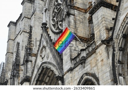 Pride flag flying on the facade of Cathedral Church of St. John the Divine in Morningside Heights, Manhattan, New York City in May 2025