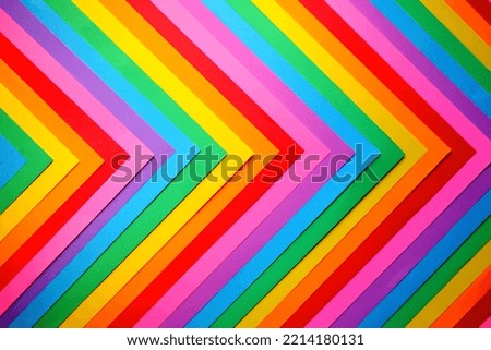 The pride flag made out of multiple colorful sheets of paper