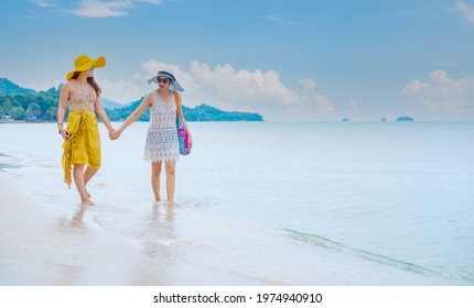 Pride And The LGBTQ Love Couple On Summer Beach. Bisexual And Homosexual Travel Together On Holiday.