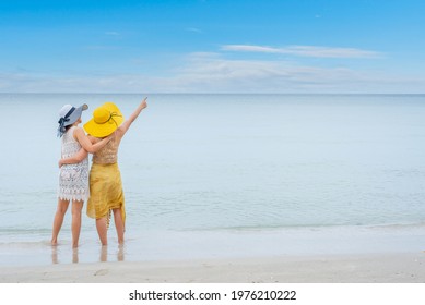 Pride And The LGBTQ Love Couple On Summer Beach. Bisexual And Homosexual Travel Together On Holiday.