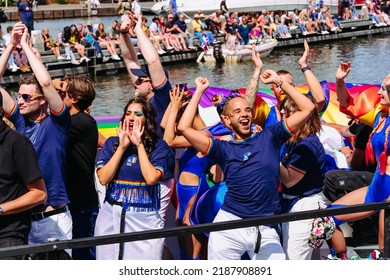 Pride Parade Of Lesbian, Gay, Bisexual, Transgender, Queer And Allies. LGBTQ People In Colorful Costumes Dancing, Smiling, Having Fun - Netherlands, Amsterdam, August 6, 2022.