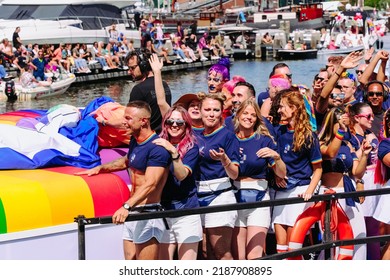 Pride Parade Of Lesbian, Gay, Bisexual, Transgender, Queer And Allies. LGBTQ People In Colorful Costumes Dancing, Smiling, Having Fun - Netherlands, Amsterdam, August 6, 2022.