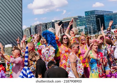 Pride Parade Of Lesbian, Gay, Bisexual, Transgender, Queer And Allies. LGBTQ People In Colorful Costumes Dancing, Smiling, Having Fun - Netherlands, Amsterdam, August 6, 2022.