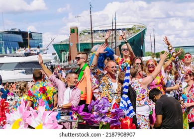 Pride Parade Of Lesbian, Gay, Bisexual, Transgender, Queer And Allies. LGBTQ People In Colorful Costumes Dancing, Smiling, Having Fun - Netherlands, Amsterdam, August 6, 2022.