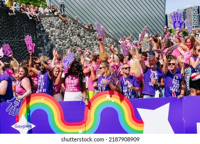 Pride Parade Of Lesbian, Gay, Bisexual, Transgender, Queer And Allies. LGBTQ Participate In Canal Parade, People In Colorful Costumes Dancing, Smiling - Netherlands, Amsterdam, August 6, 2022.