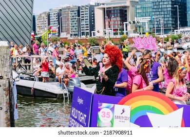 Pride Parade Of Lesbian, Gay, Bisexual, Transgender, Queer And Allies. LGBTQ Participate In Canal Parade, People In Colorful Costumes Dancing, Smiling - Netherlands, Amsterdam, August 6, 2022.