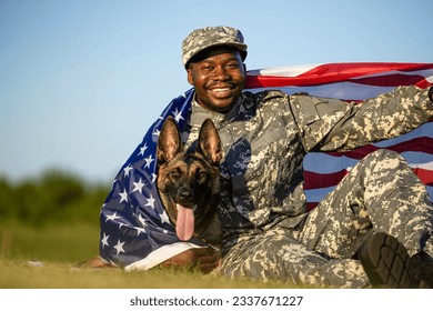 Pride of the USA. Soldier and military dog covered with American national flag celebrating Independence day.