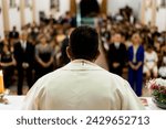 priest at altar giving mass in his church